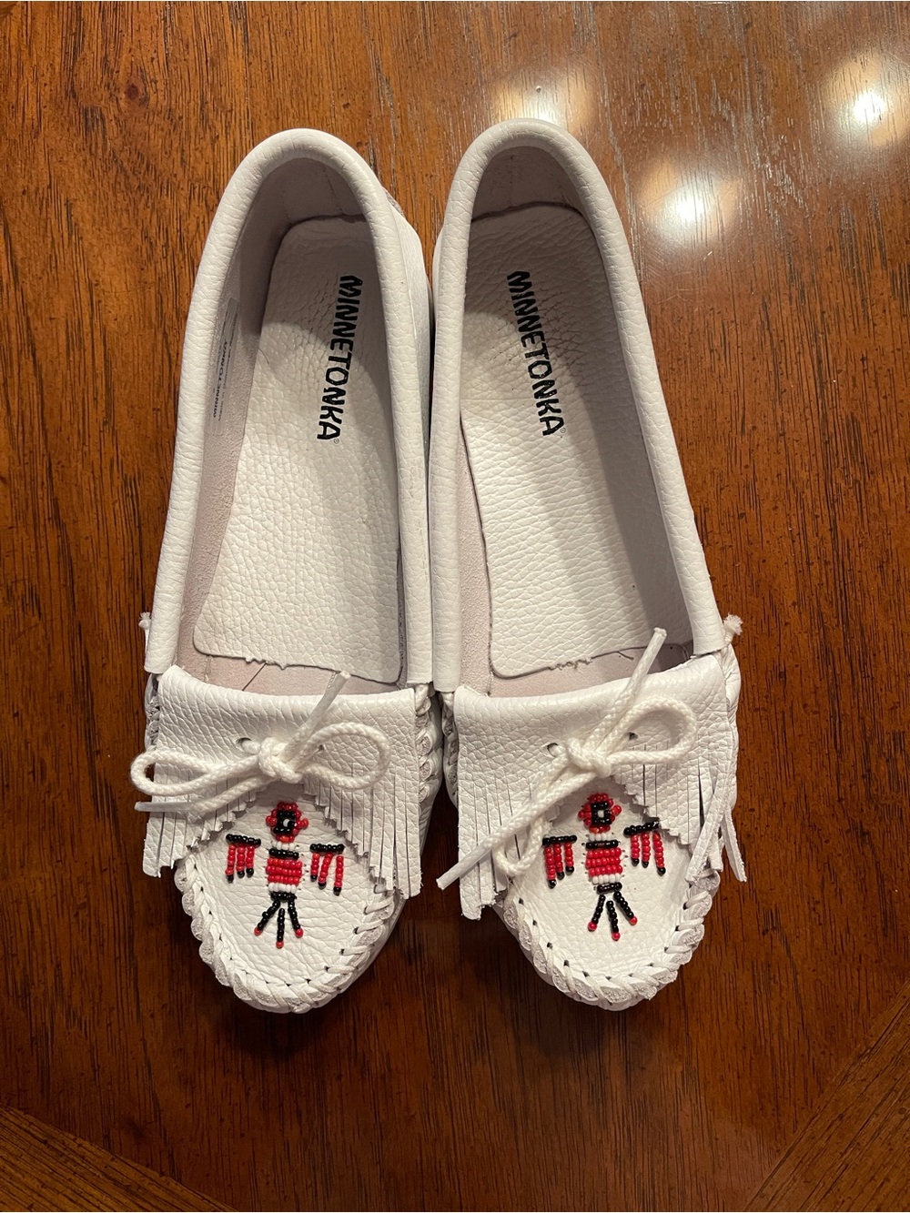 Minnetonka Thunderbird White Leather Slip-On Moccasins with Bead Accent